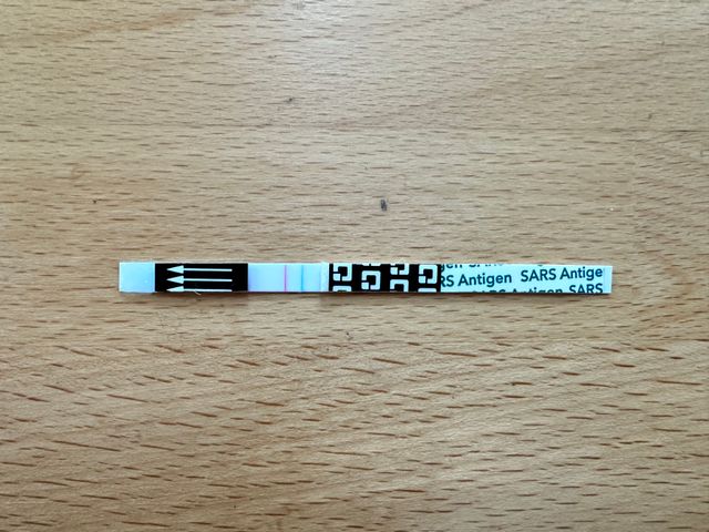 A positive QuickVue test strip