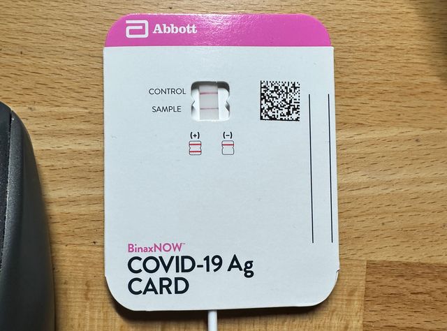 A positive BinaxNOW card